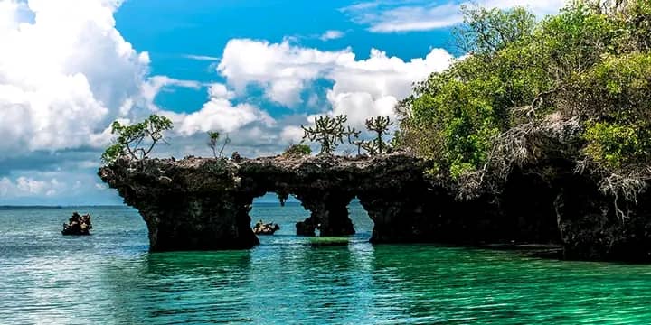 Zanzibar Natural Rock Arch Over Turquoise Sea