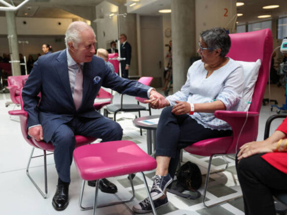 Grinning, King Charles returns to public duties by visiting a cancer center