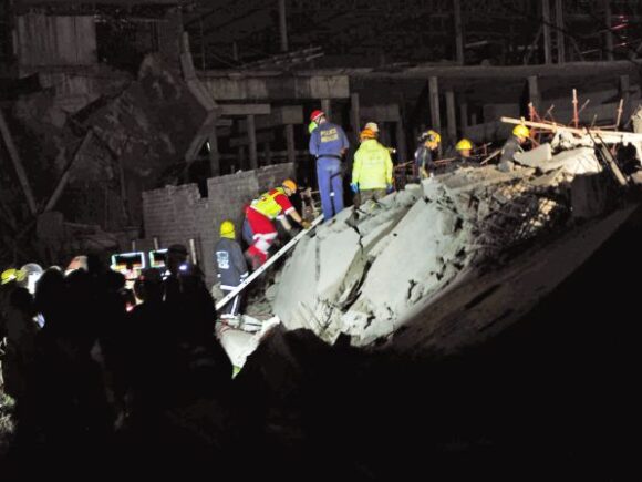 After a building collapse in South Africa that claimed 33 lives, rescue operations were suspended