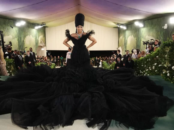 In the midst of the gown controversy, Cardi B clarifies the record and says that Vogue invited her to the Met Gala