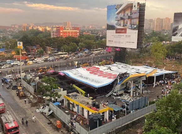 At least 14 people are killed in a massive billboard collapse in Mumbai during a storm