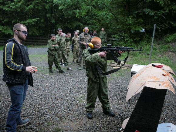 Children in war-torn Russia switch from the classroom to the firing range