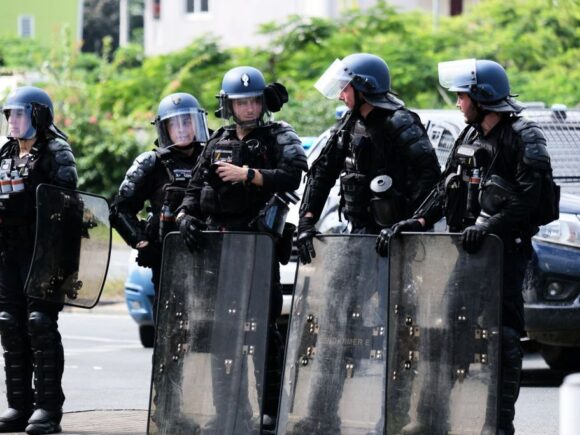 To protect New Caledonia, hundreds more French police officers begin to arrive