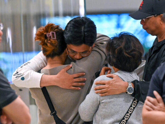 After a fatal flight, shocked passengers land in Singapore