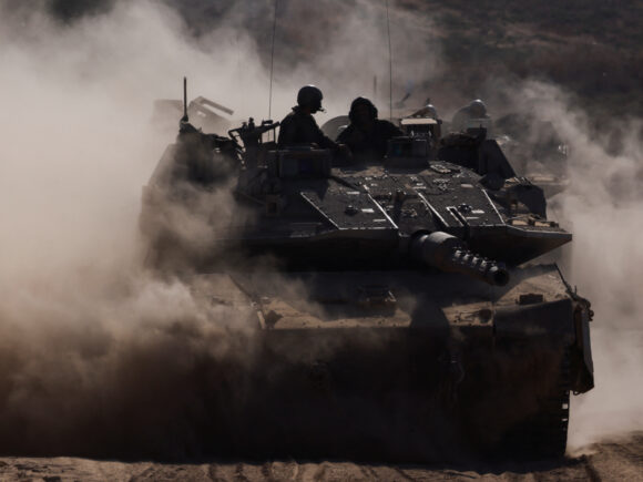 Tanks move forward in Gaza as Palestinian militants launch missiles toward Israel