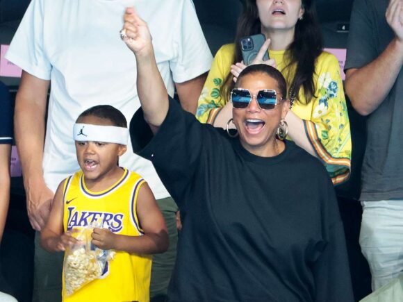 Queen Latifah and her son make an unusual appearance as they support Team USA at the Olympics