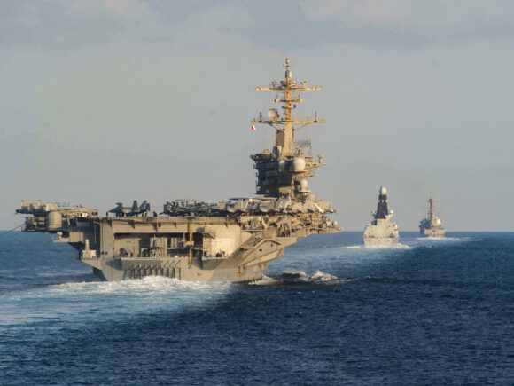 The United States has deployed a missile submarine and has accelerated the deployment of an aircraft carrier to the Middle East in response to the increasing tensions