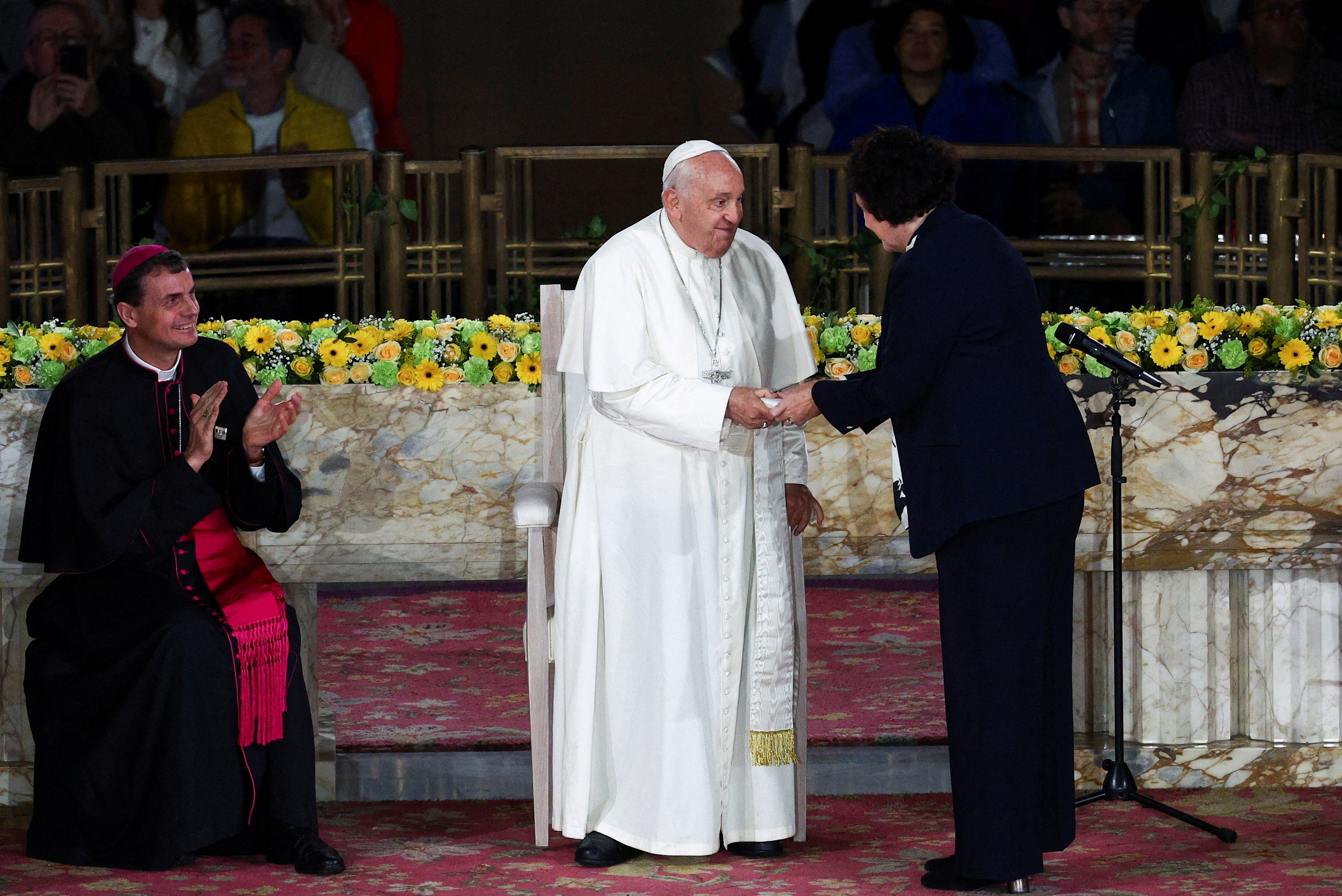 A Belgian Catholic university criticized Pope Francis just minutes after he visited