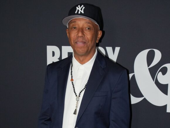 Russell Simmons is being sued for sexual harassment and is being accused of avoiding a deposition