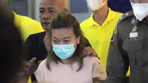 A Thai woman was given a death sentence for killing 14 friends via cyanide