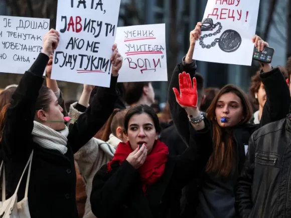 Serbian students demonstrate against the train station tragedy by marching in Belgrade