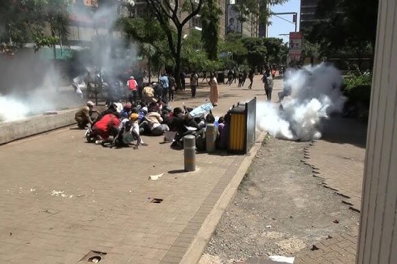 Kenyan police use tear gas during a demonstration about suspected kidnappings