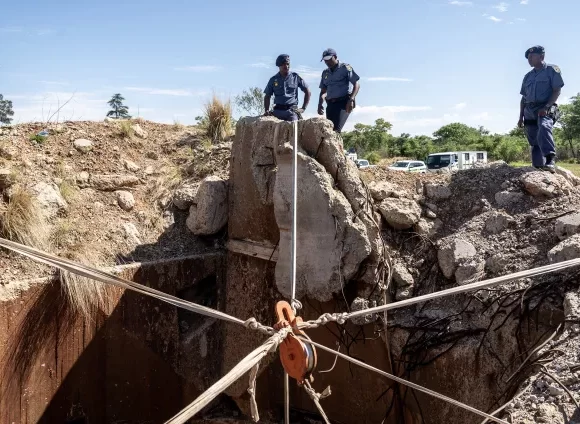 Footage from a South Africa raid reveals dead bodies underground and imprisoned miners