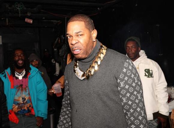 Rapper Busta Rhymes is accused of assaulting his assistant and has since surrendered