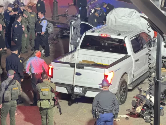 Ten are killed when a man wrecks a truck into a crowd in New Orleans and starts shooting