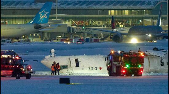 18 people are hurt as a Delta jet turns over upon arrival at Toronto Airport