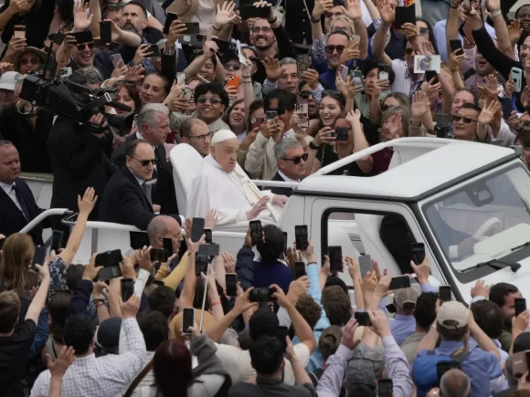 Pope Francis, recuperating from illness, welcomes jubilant Easter crowds from the popemobile