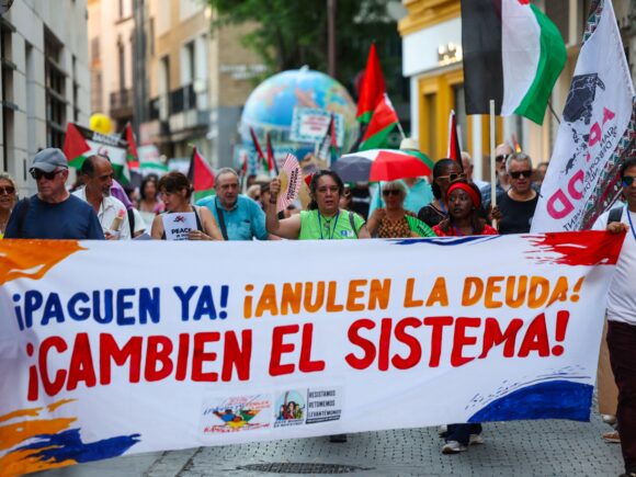 Protesters call for climate action and debt elimination before the UN conference