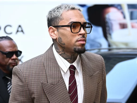 Chris Brown enters a not guilty plea in a UK court to a reduced assault charge