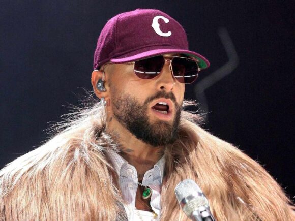 Maluma, a Latino musician, interrupts her performance to chastise a fan who is wearing a baby without ear protection