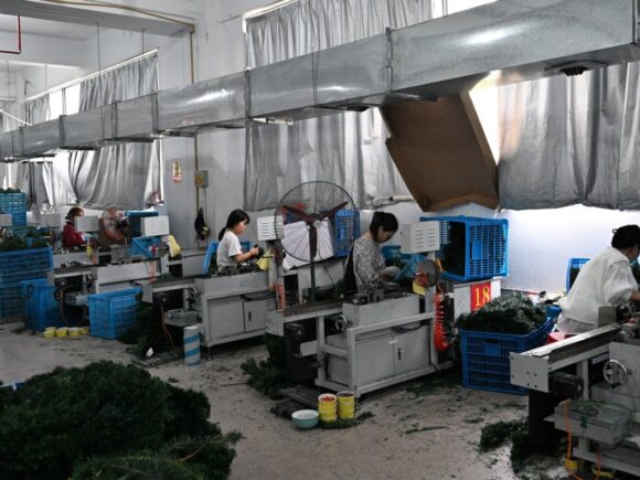 Chinese factory owners cut wages and costs to withstand competition and tariffs