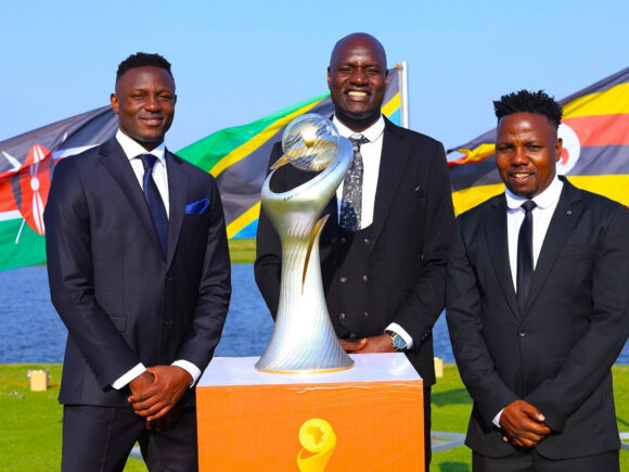 Goalie Onyango, Wanyama, and Ngasa present the CAF CHAN trophy