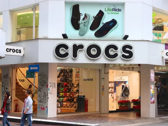 Crocs’ stock drops 30% due to declining US sales, economic pressures, and a shift in consumer preferences toward athletic footwear
