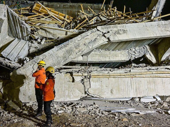 A school collapse in Indonesia claims three lives and traps dozens more