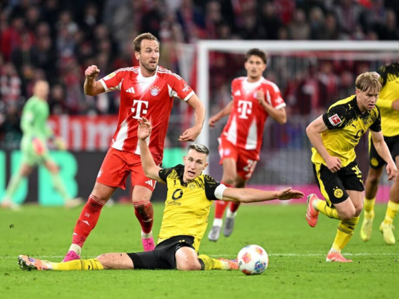 Kane scores and assists as Bayern ends Dortmund’s winning streak with a 2-1 victory