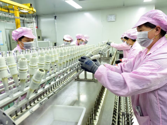 China’s economy slows, with factory output and retail growth at their lowest levels in more than a year