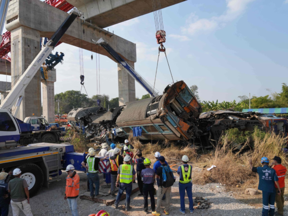 In Thailand, a crane collapses, killing at least 22 people after colliding with a passenger train