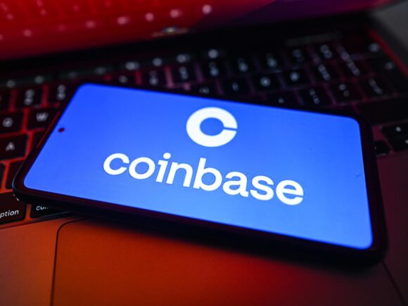 Coinbase Cuts 700 Jobs While Investing Heavily in AI Amidst Crypto Market Downturn