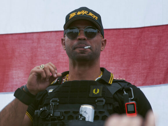 A leader of “proud boys” who burned a BLM banner wants $5 million from Trump’s secret fund