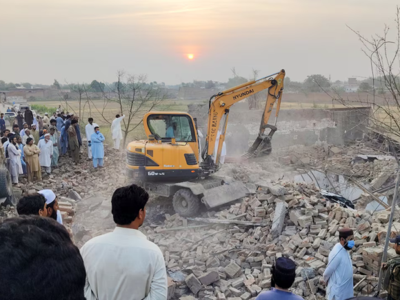 14 officers lose their lives in a car bombing and ambush at a police station in Pakistan