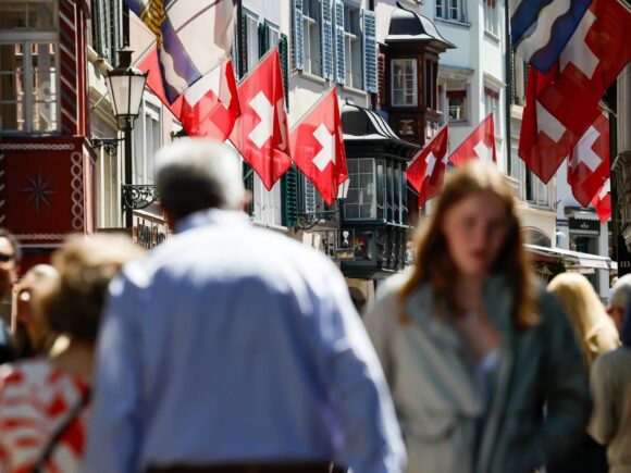 Switzerland votes on a population cap that could limit immigration and add stress to ties with the EU