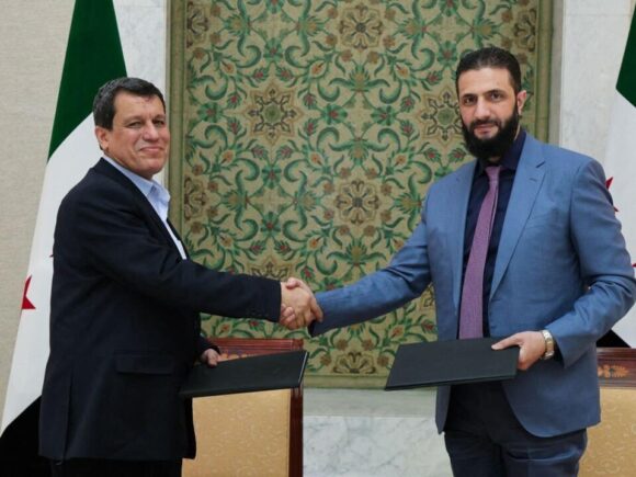 Syrian president appoints former leader of Kurdish-led force as an adviser